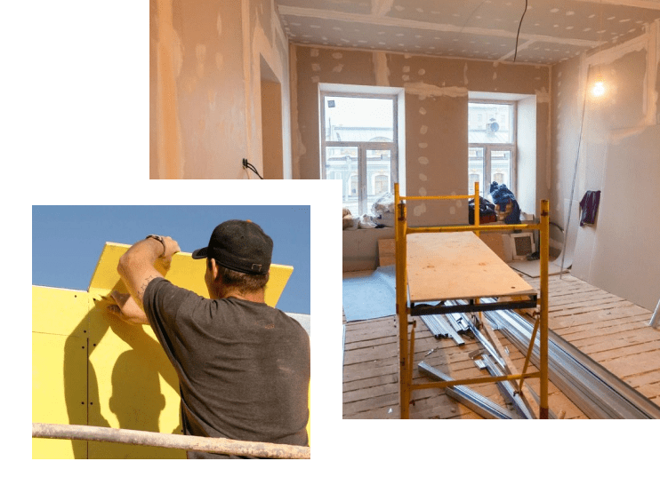 A man is working on the wall of his home.